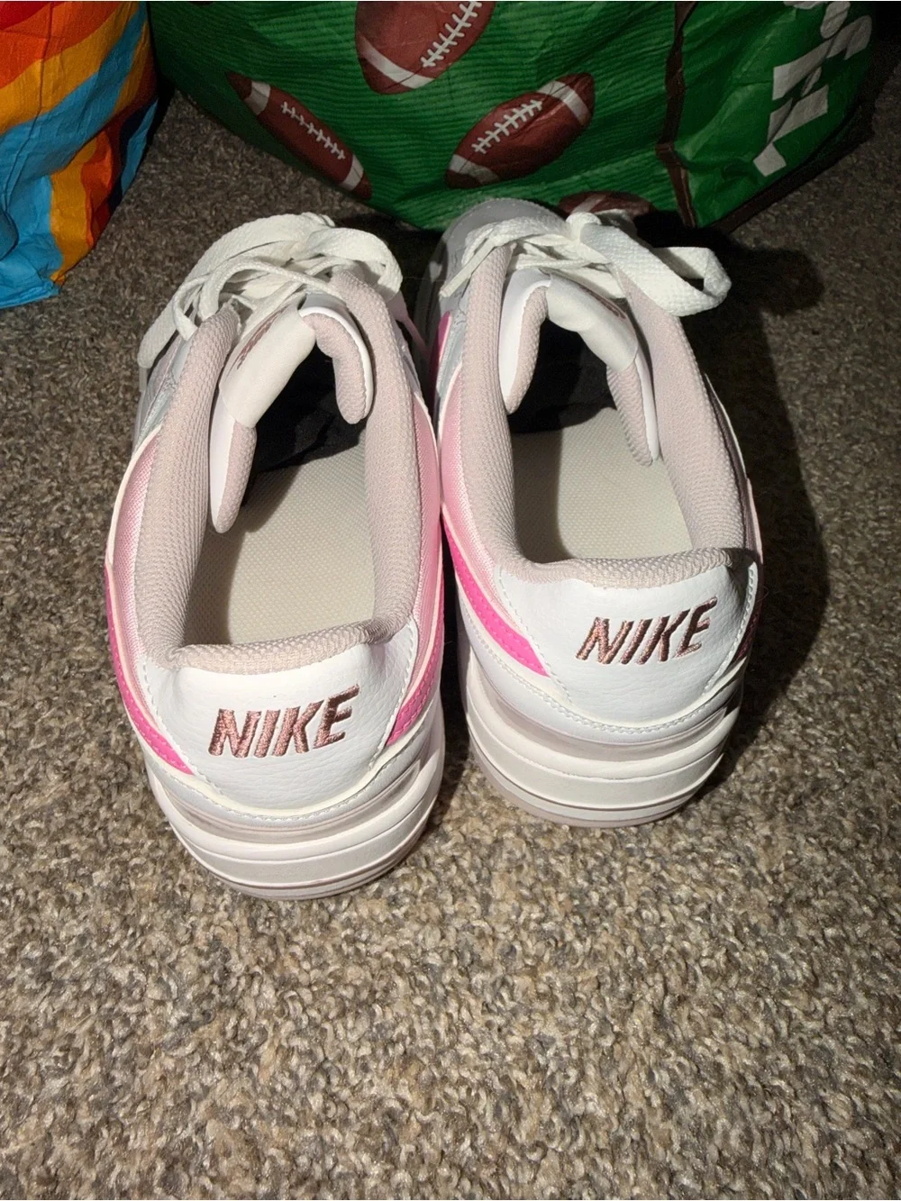Nike Women’s White Sneakers with Pink Swoosh and Pale Pink Accents